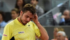 le-suisse-stanislas-wawrinka-venant-de-perdre-un-point-face-a-l-autrichien-dominic-thiem-le-6-mai-2014-au-masters-1000-de-madrid_4894267[1].jpg